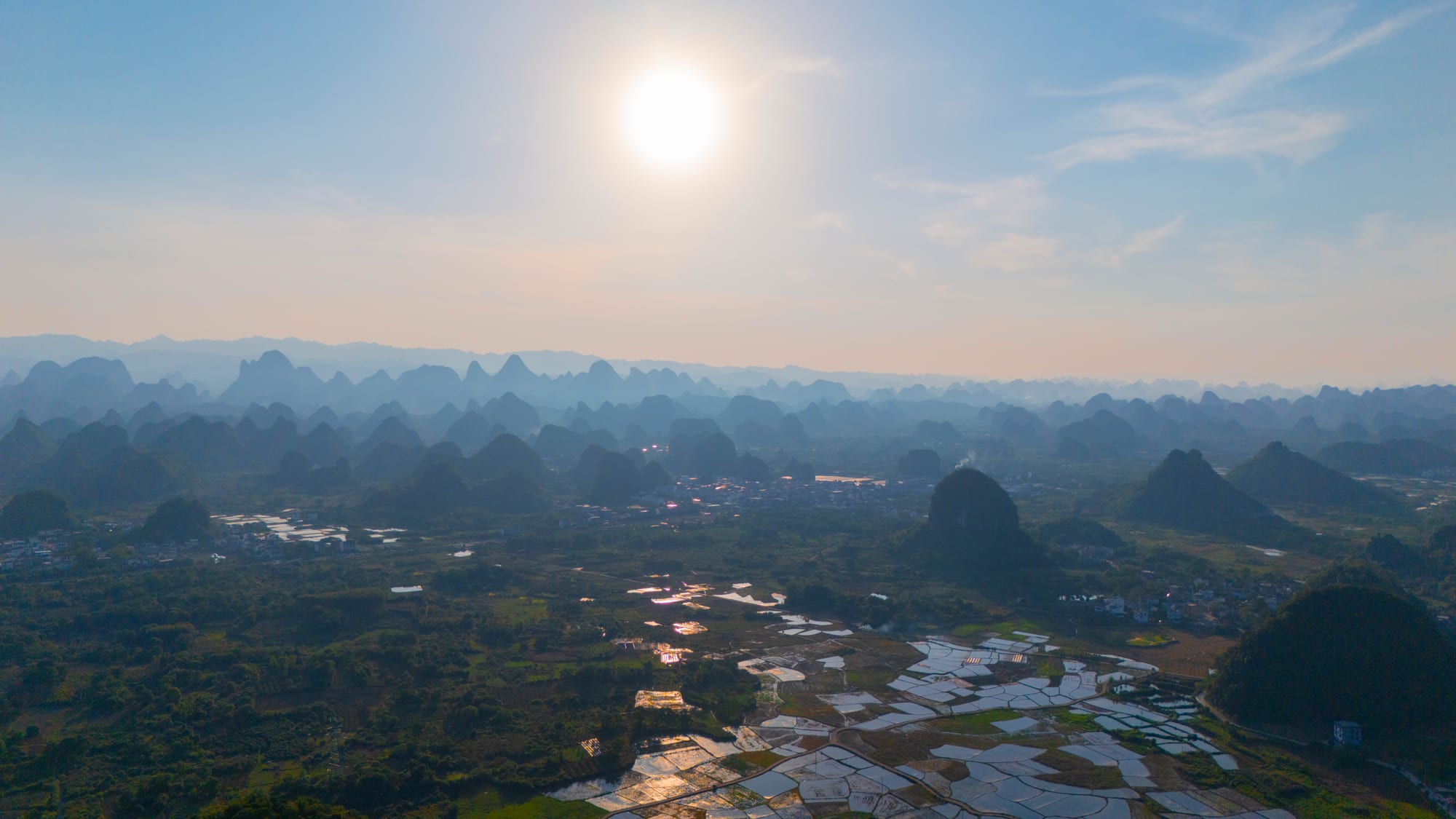 Karst peaks over still water at dawn