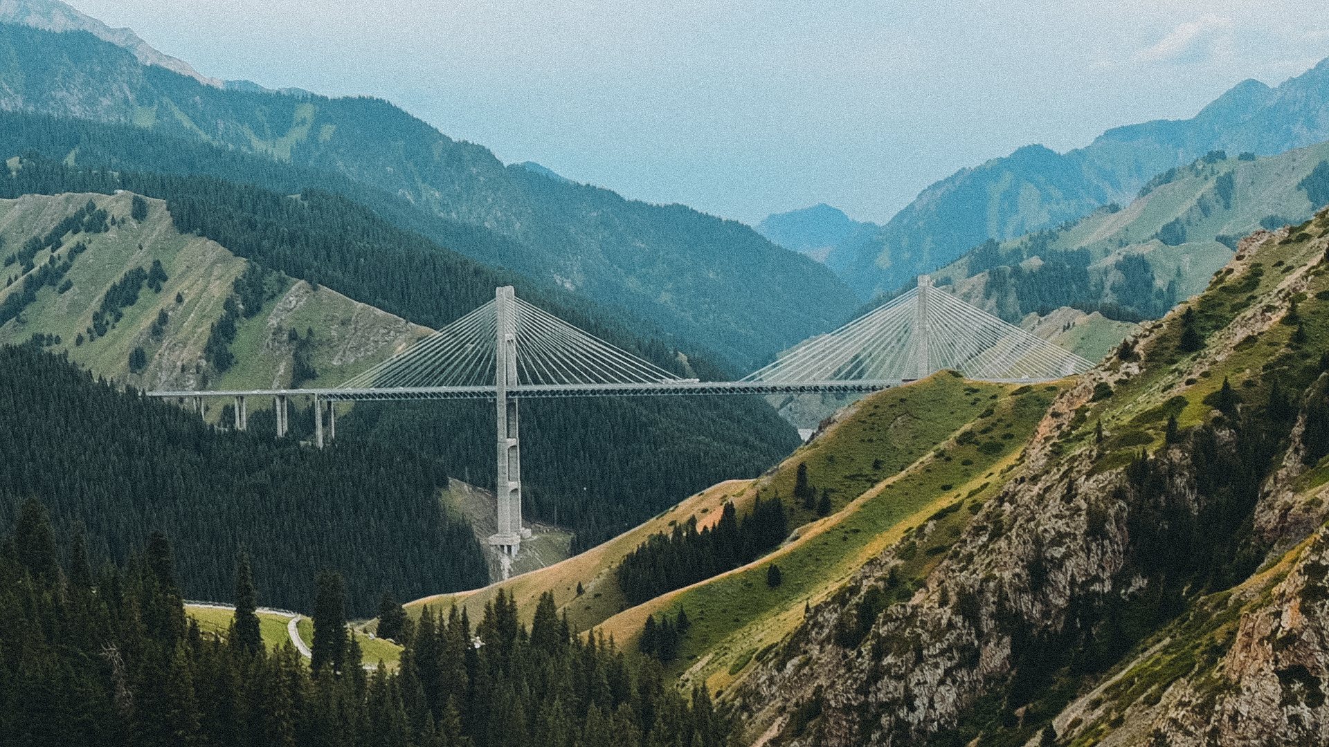 Cable-stayed bridge crossing a mountain valley