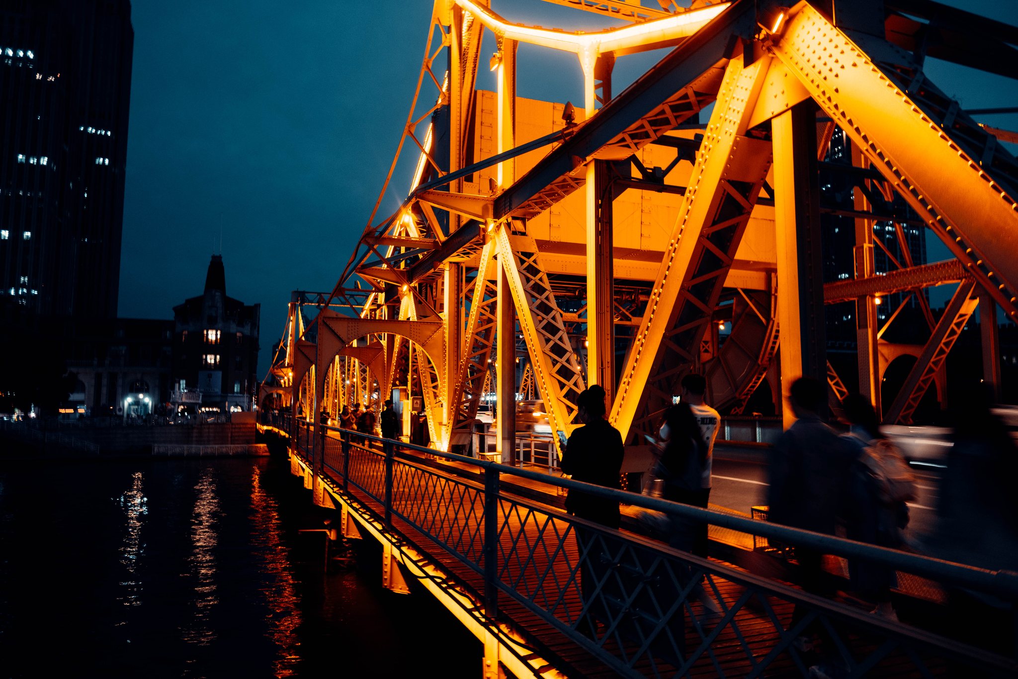 Illuminated iron bridge at night