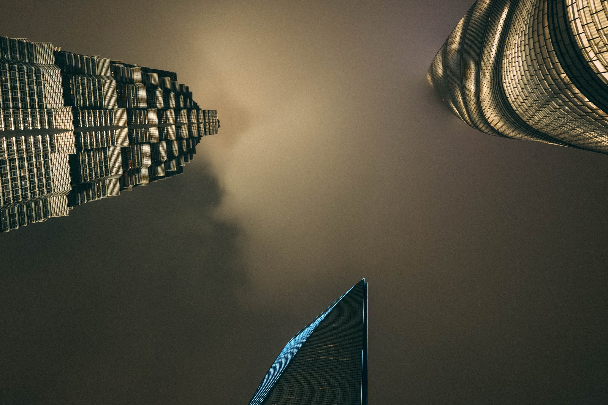 Skyscrapers rising into fog