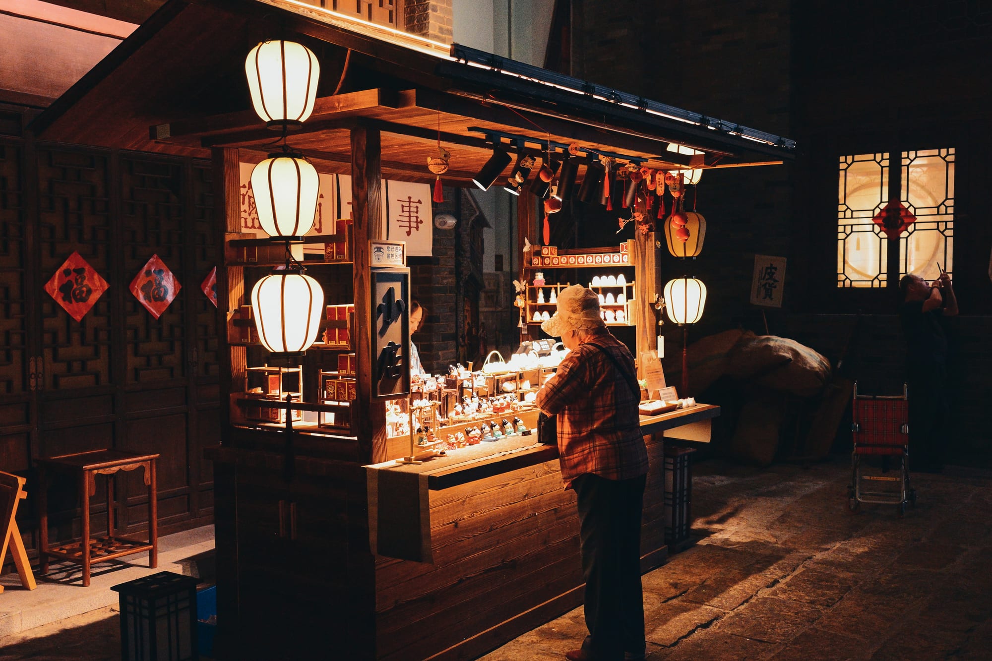 A night market stall lit by lanterns