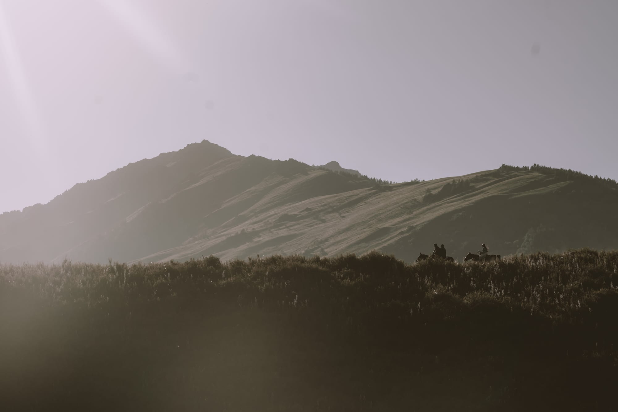 A hazy mountain ridge in low light