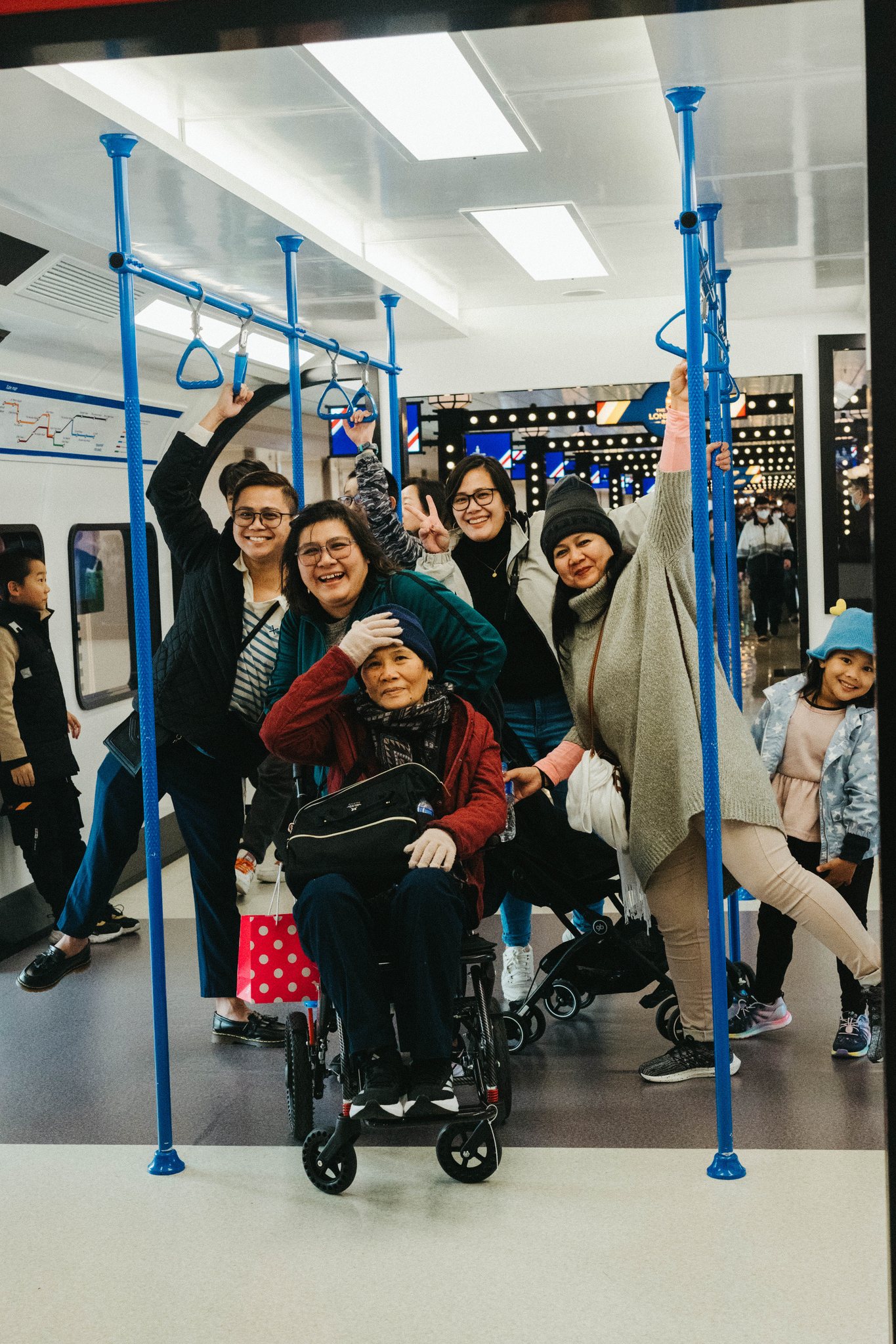 Family posing together on a train